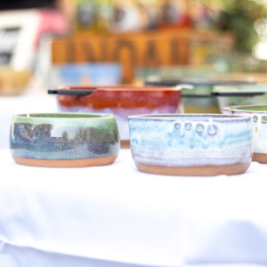 Pottery on a table at fine art festival in Meredith.